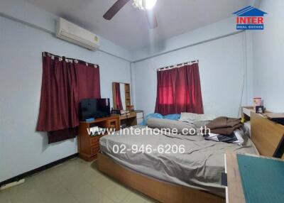 Bedroom with a double bed, ceiling fan, air conditioner, and burgundy curtains