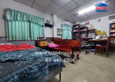 Spacious bedroom with work area and storage