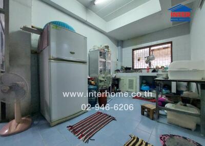 A kitchen with appliances and various items