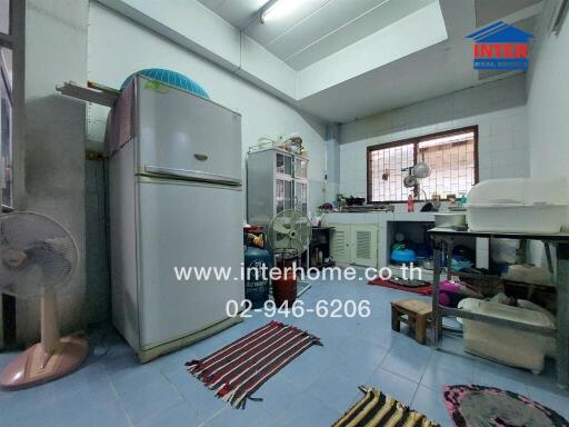 A kitchen with appliances and various items