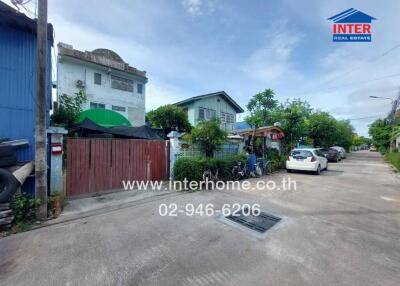 Street view with residential buildings and parked cars