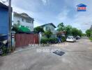 Street view with residential buildings and parked cars