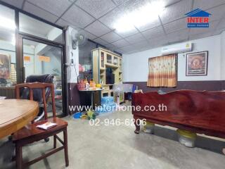 Living room with wooden furniture and air conditioning unit