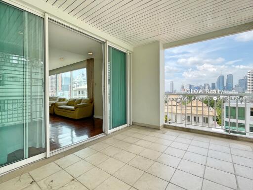 Spacious balcony with city view and access to living room