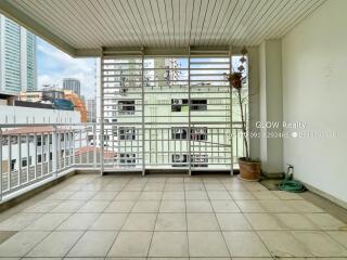 Spacious balcony with tile flooring and city view