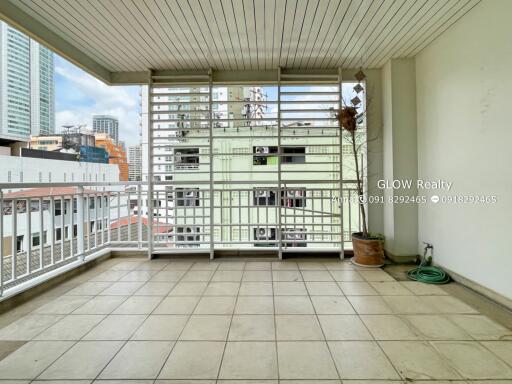 Spacious balcony with tile flooring and city view