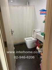 Bathroom with a toilet and shower