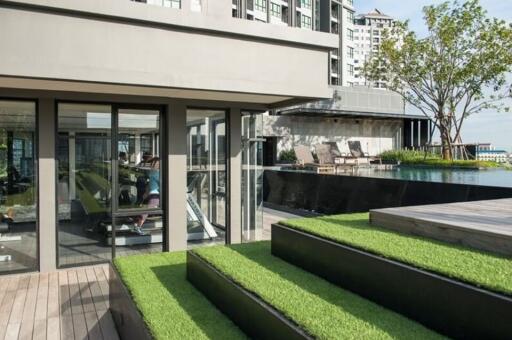 Outdoor area with a pool and gym