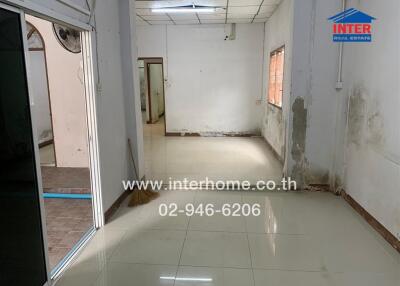 Spacious unfurnished living area with tiled floor