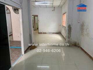 Spacious unfurnished living area with tiled floor