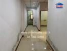 Hallway in a residential building with visible signs of wear