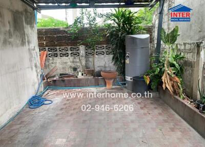 Backyard with storage tank and plants