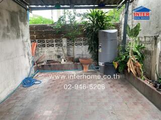 Backyard with storage tank and plants