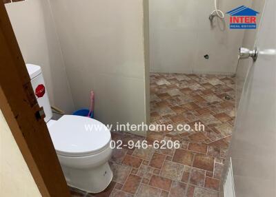 Bathroom with toilet and shower area