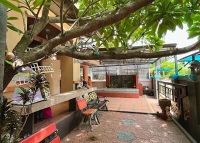 Outdoor area with seating and greenery