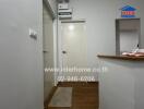 Hallway with wooden flooring and white walls