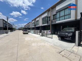 Street view of modern townhouses with driveways