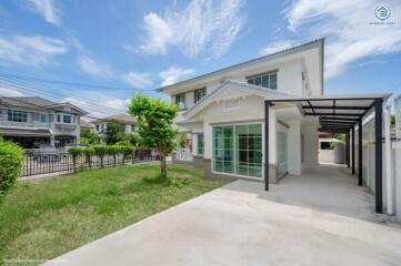 Modern house with driveway and front lawn