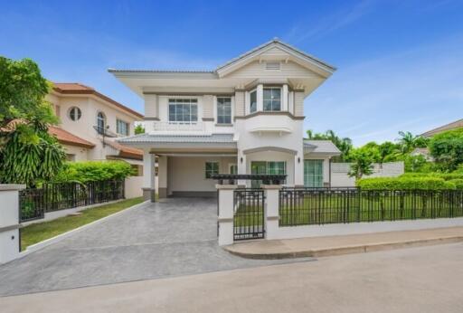 Front view of a modern two-story house with a driveway