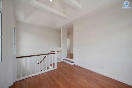 Bright and open main living area with wooden flooring and modern finishes