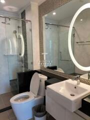 Modern bathroom with large mirror and shower