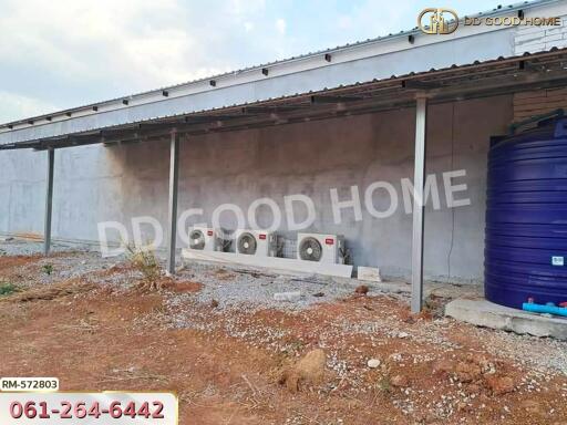 Outdoor area with air conditioning units and water tank