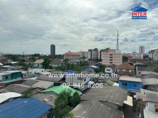 View of a neighborhood with various buildings and houses