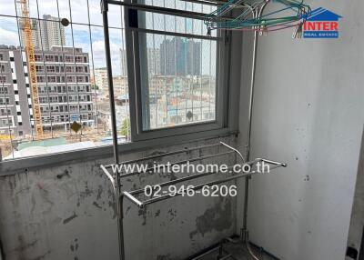 Balcony with drying racks and scenic urban view