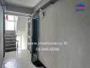 View of a hallway and staircase in a residential building