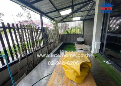 Covered outdoor area with a small pool