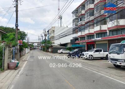 street outside building with multiple cars parked