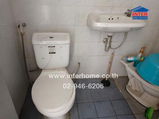 simple bathroom with toilet and sink