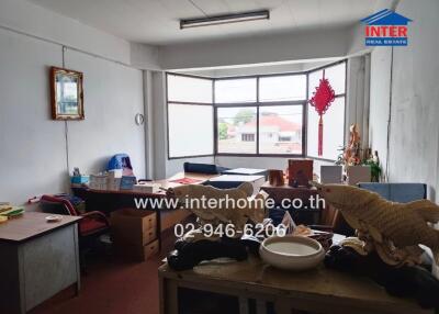 Office space with large window and decorative items