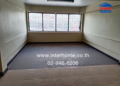 Empty room with large windows