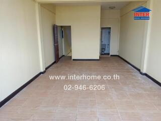 An empty room with tiled floor