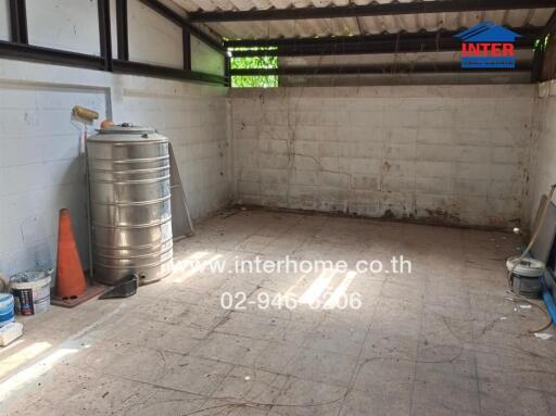 Indoor storage room with metal water tank