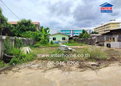 Vacant lot with small house