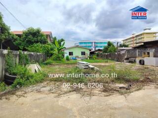Vacant lot with small house