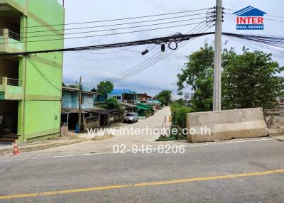 View of street with buildings and trees