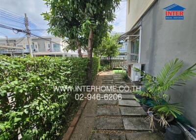 Well-maintained garden area with a walkway and plants