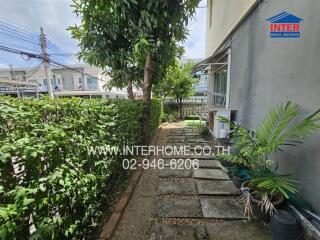 Well-maintained garden area with a walkway and plants