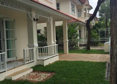 Front view of house with porches and green lawn