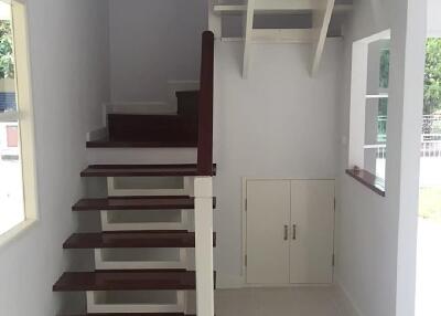 Indoor wooden staircase with storage underneath