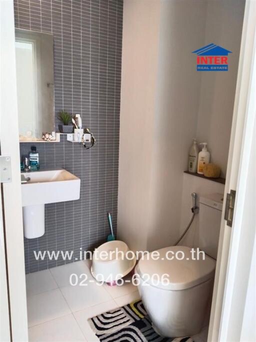 Modern bathroom with a wall-mounted sink and toilet