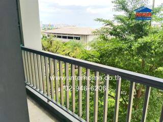 Balcony with a railing overlooking greenery