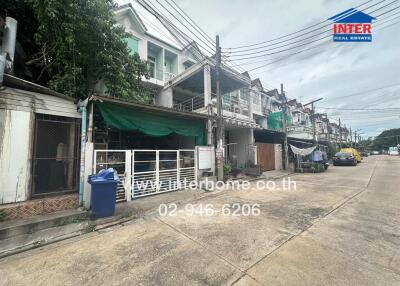 Exterior view of a residential building with street access