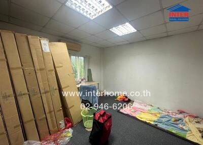 Bedroom with window and unpacked items