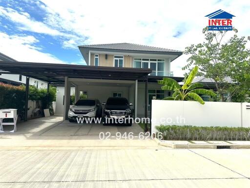 Exterior view of a modern house with a carport