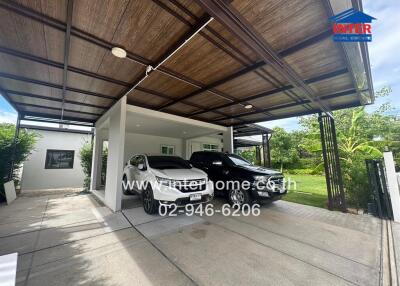Double carport with two vehicles
