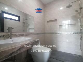 Modern bathroom with shower and vanity